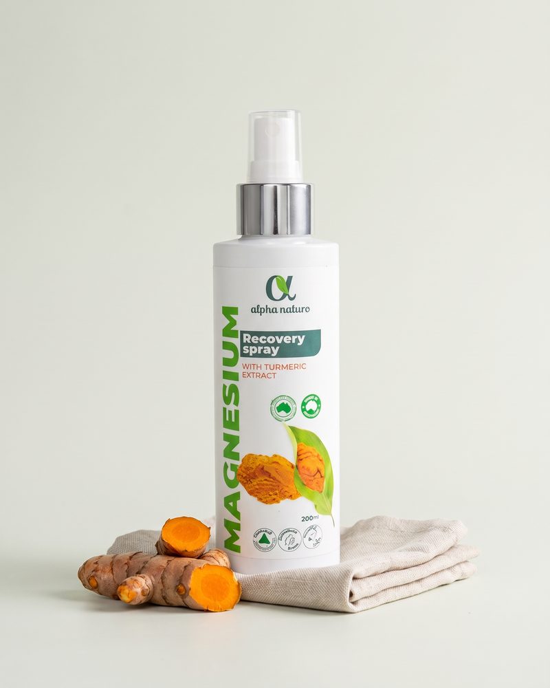 Magnesium Recovery Spray with Turmeric on a light studio backdrop